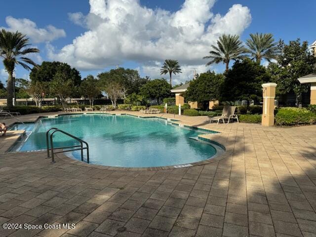 view of pool featuring a patio