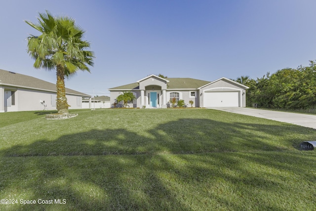 view of front facade featuring a front yard and a garage