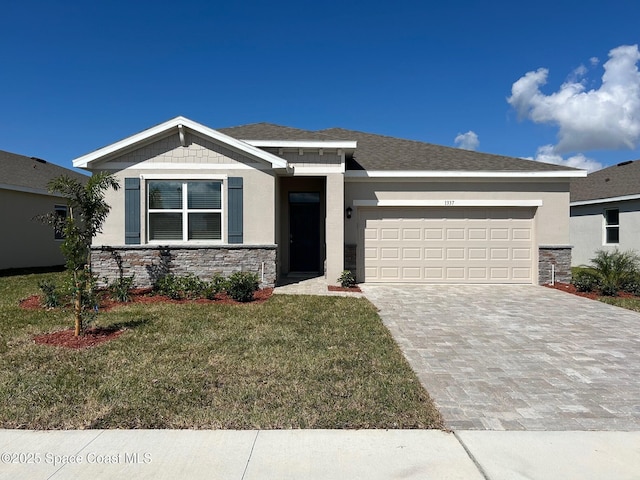 view of front of home with a garage and a front yard