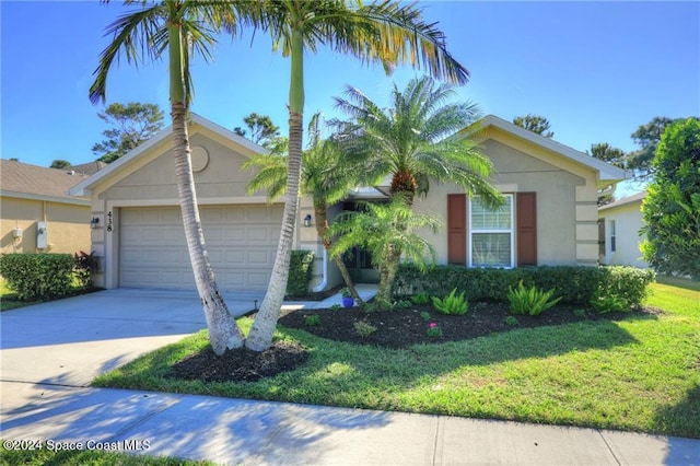 ranch-style home with a front yard and a garage