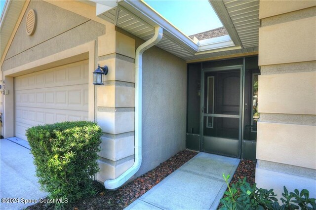 438 Briarcliff Cir, Sebastian, FL 32958 - view of exterior entry featuring a garage