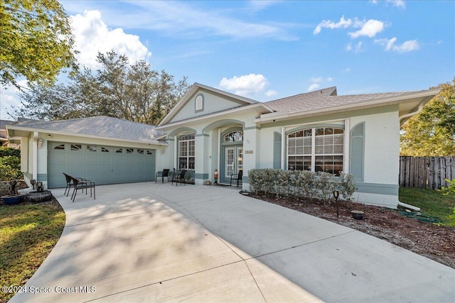 ranch-style home featuring a garage