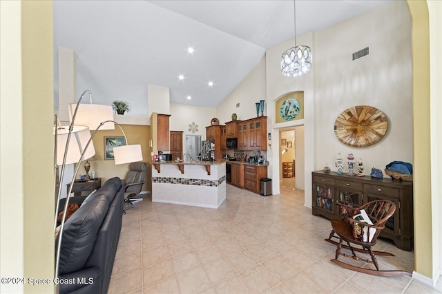 living room featuring high vaulted ceiling