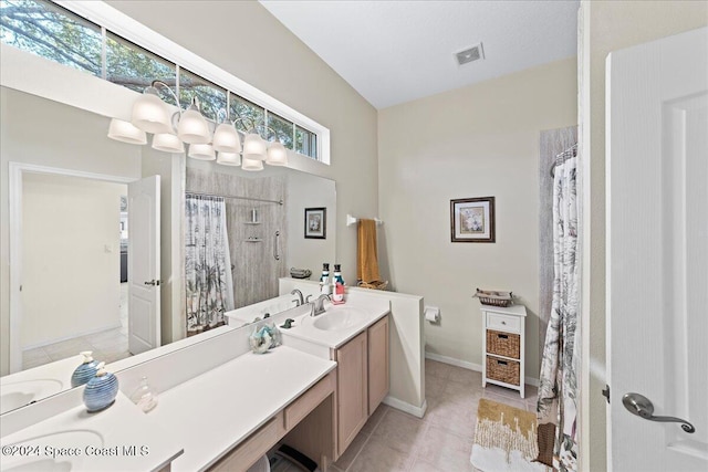 bathroom featuring curtained shower, tile patterned flooring, and vanity