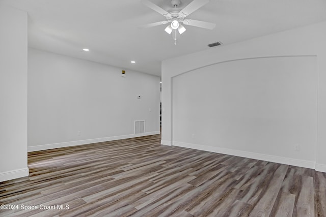 unfurnished room with ceiling fan and light wood-type flooring