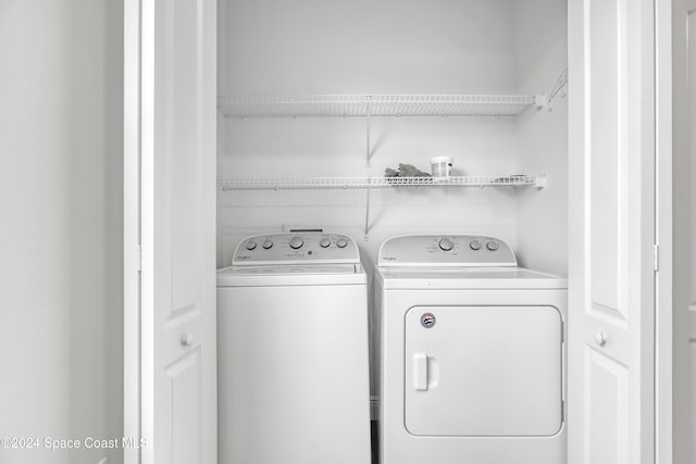 laundry area with washer and clothes dryer