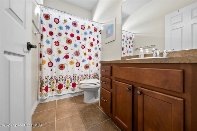 bathroom featuring a shower with curtain, tile patterned flooring, vanity, and toilet