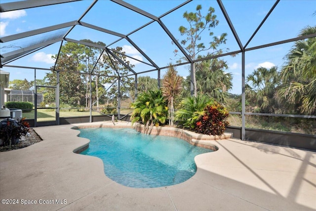 view of pool featuring a lanai, a patio, and central AC