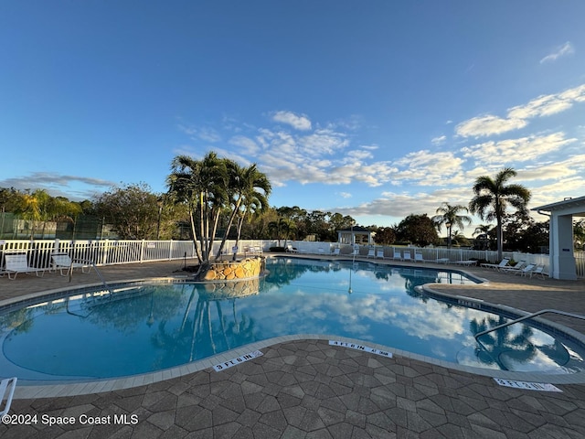 view of swimming pool featuring a patio