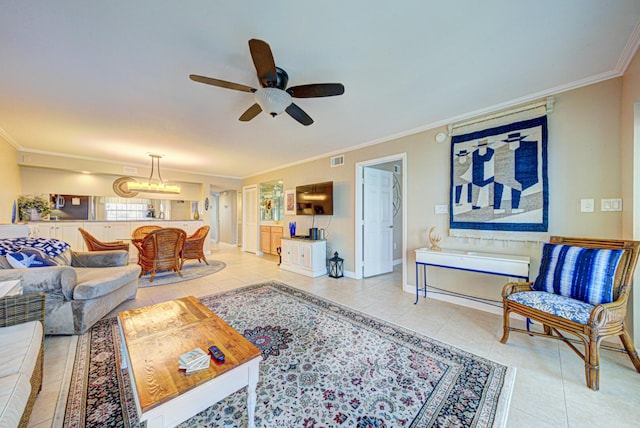 tiled living room with ceiling fan and ornamental molding