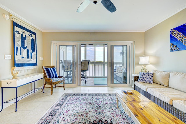 living room with light tile patterned floors, ceiling fan, and ornamental molding