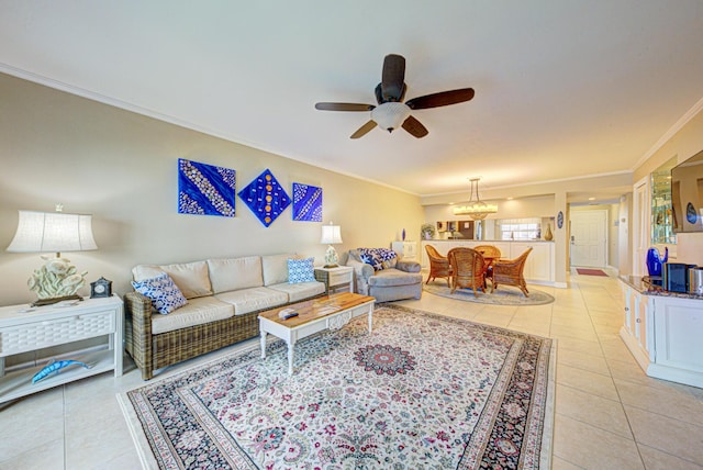 tiled living room with ceiling fan and ornamental molding