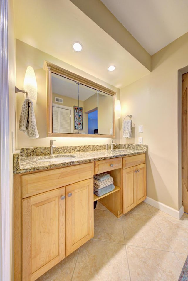 bathroom featuring tile patterned floors and vanity