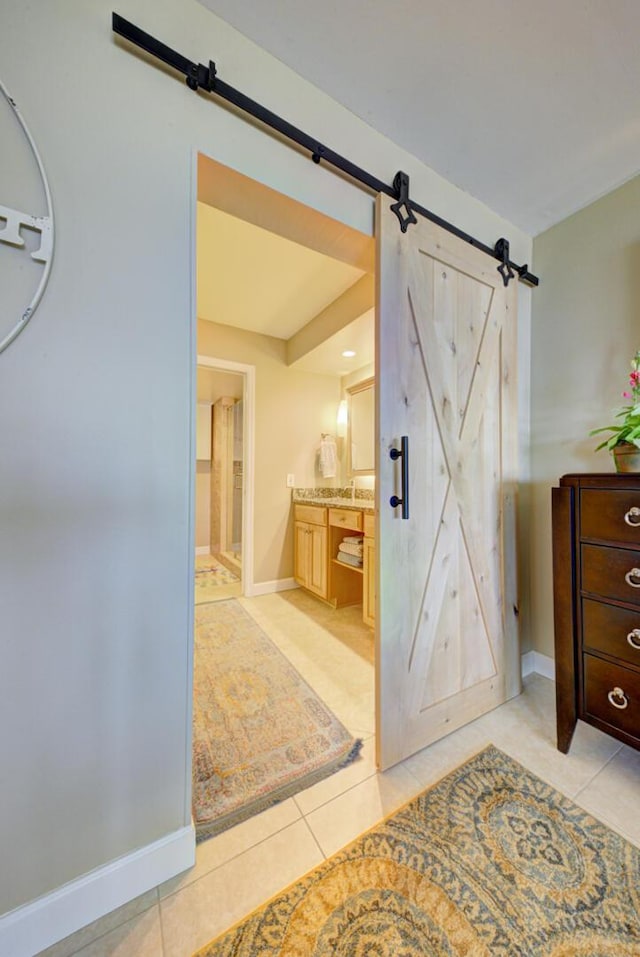 bathroom with tile patterned floors and vanity