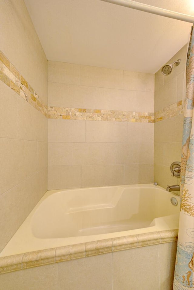 bathroom featuring shower / tub combo with curtain