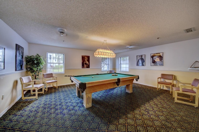 game room featuring a wealth of natural light, carpet, a textured ceiling, and pool table