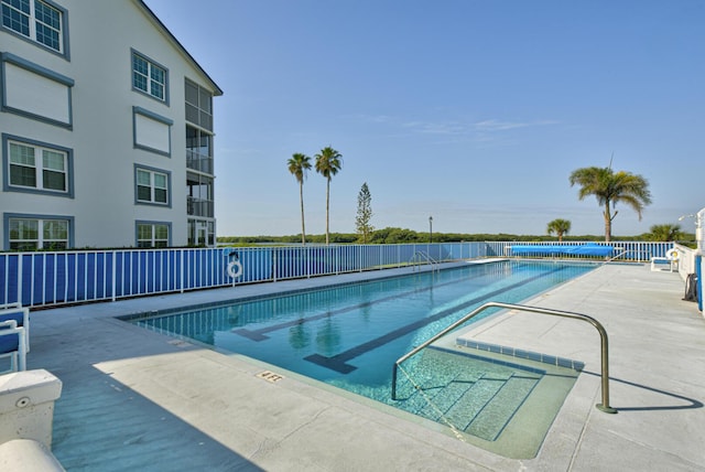 view of swimming pool with a patio