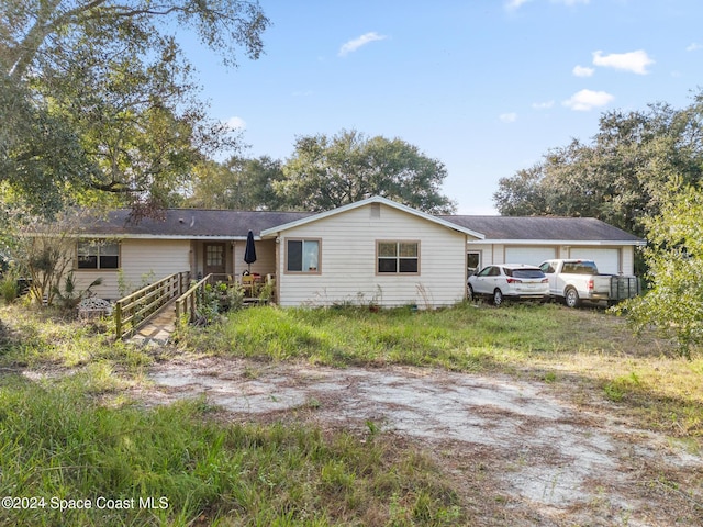 single story home featuring a garage