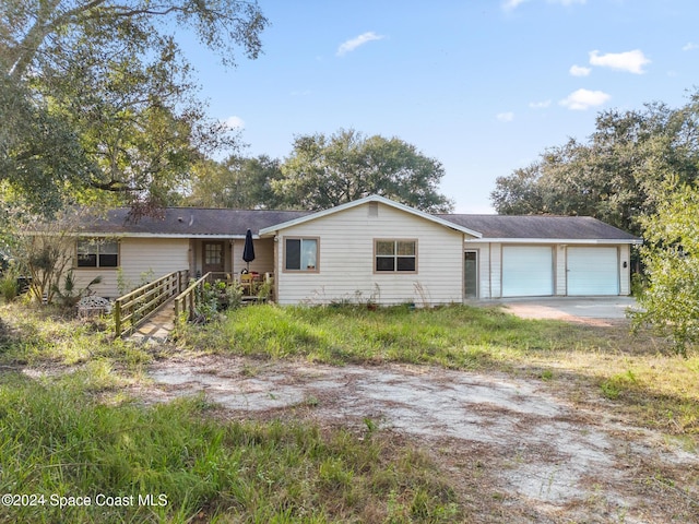 ranch-style home featuring a garage