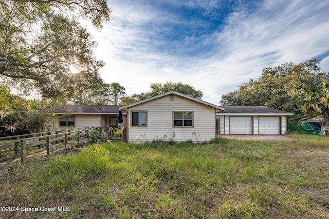 single story home with a garage