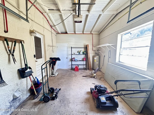 exercise room featuring vaulted ceiling and water heater