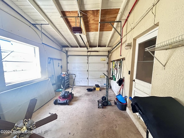 garage featuring a garage door opener