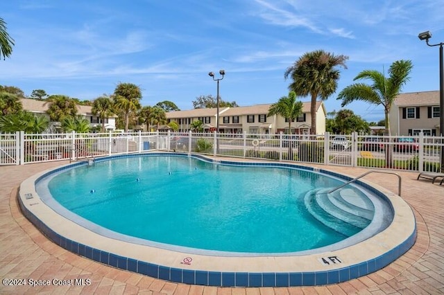 view of swimming pool featuring a patio area