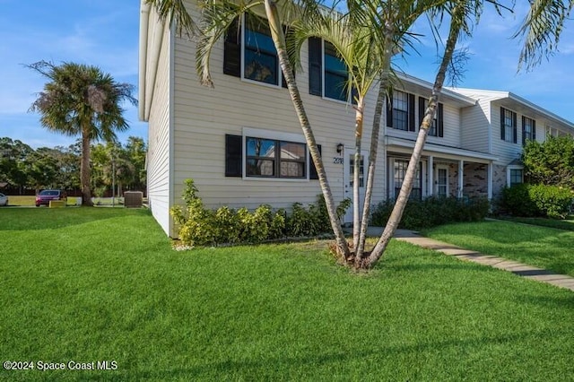 view of front of property featuring central AC and a front lawn