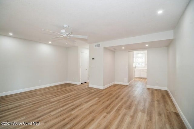 interior space with ceiling fan and light hardwood / wood-style floors