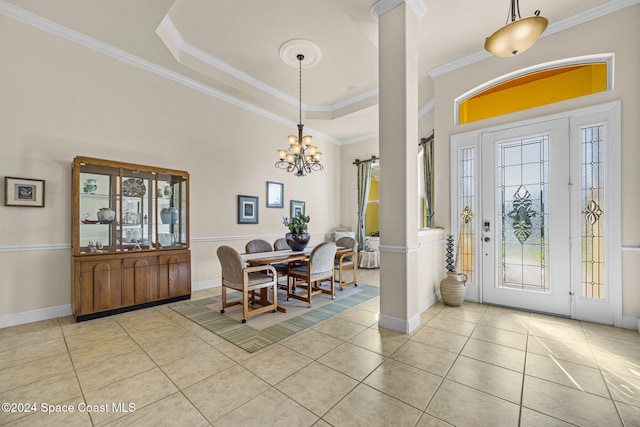 tiled dining room with a wealth of natural light, crown molding, and a notable chandelier