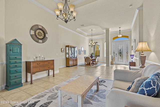 living room with a chandelier, light tile patterned floors, and ornamental molding