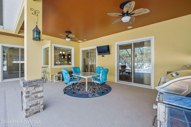 view of patio / terrace featuring ceiling fan