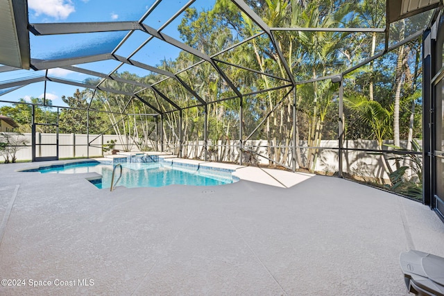 view of swimming pool featuring glass enclosure and a patio