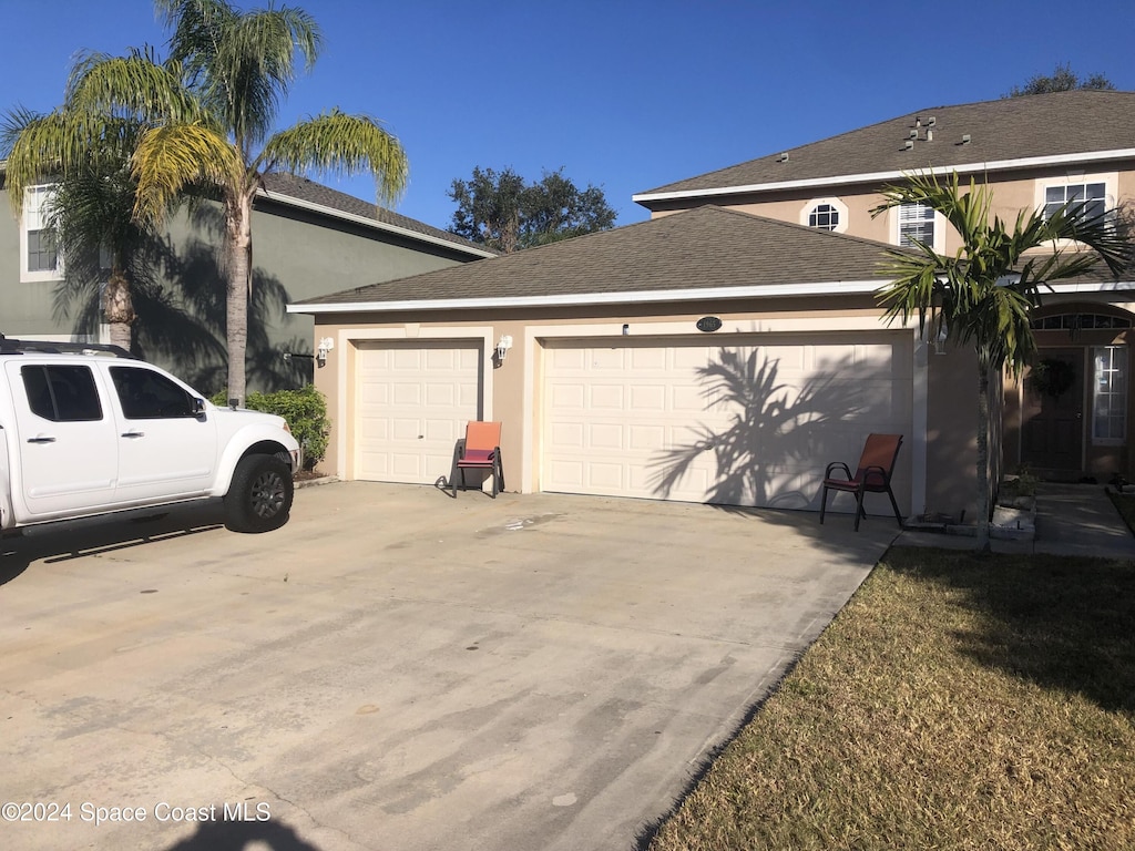 view of property exterior featuring a garage