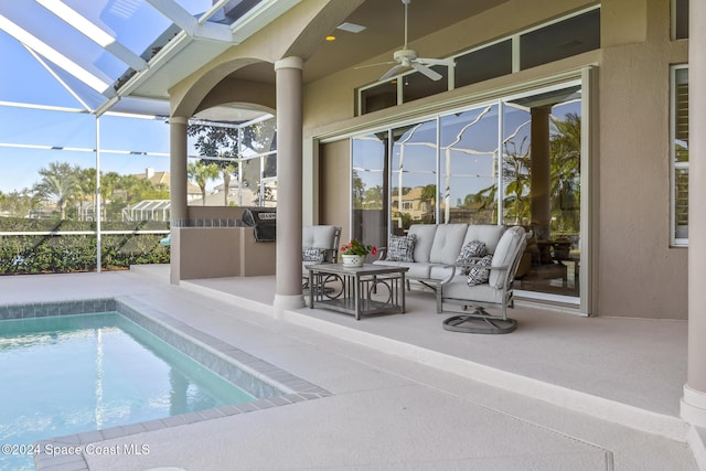 view of swimming pool with a patio, an outdoor hangout area, and ceiling fan