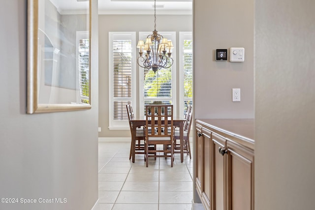 tiled dining area with a notable chandelier