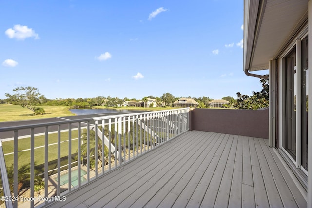 wooden deck featuring a water view