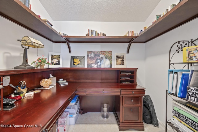 office area featuring a textured ceiling