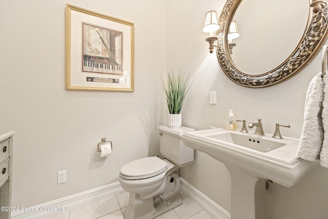 bathroom with tile patterned floors, sink, and toilet