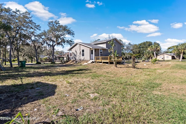 view of yard with a deck