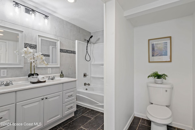 full bathroom with vanity, toilet, and tiled shower / bath