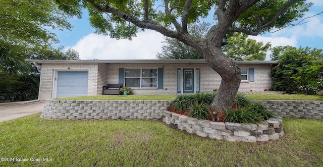 ranch-style home with a front lawn and a garage