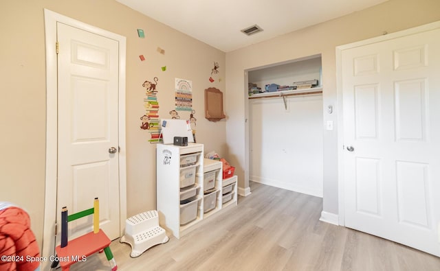 recreation room featuring light hardwood / wood-style flooring