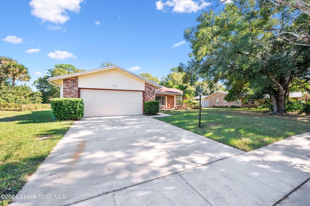 single story home featuring a front yard and a garage