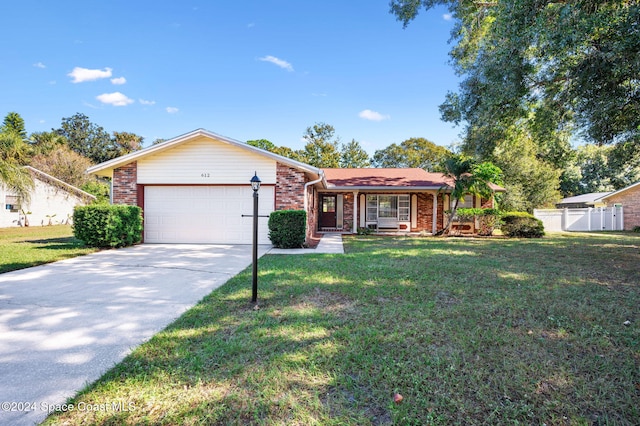 ranch-style house with a front yard and a garage