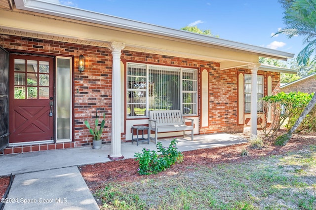 entrance to property featuring covered porch