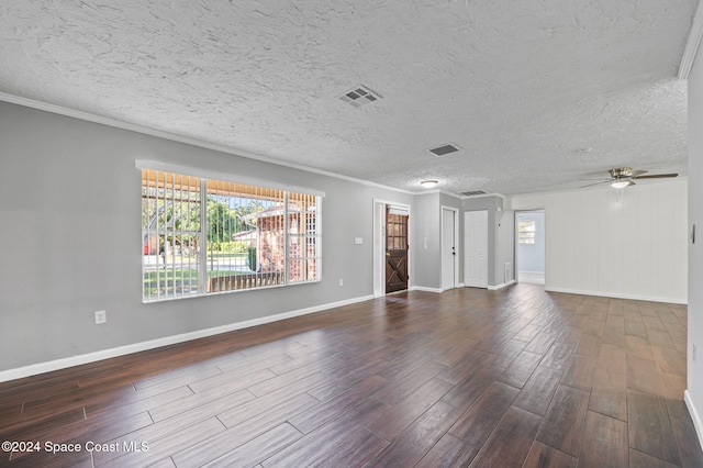 unfurnished room with a textured ceiling, crown molding, ceiling fan, and dark wood-type flooring