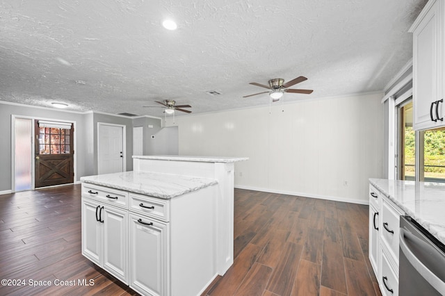 kitchen featuring white cabinets, a healthy amount of sunlight, and dark hardwood / wood-style floors