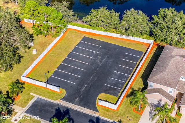 birds eye view of property featuring a water view