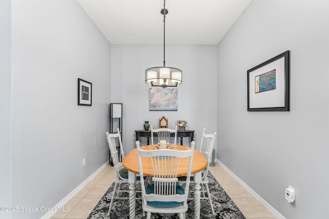 dining space featuring an inviting chandelier and light tile patterned floors